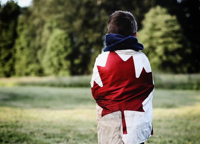 Child wraped in a Canada Flag